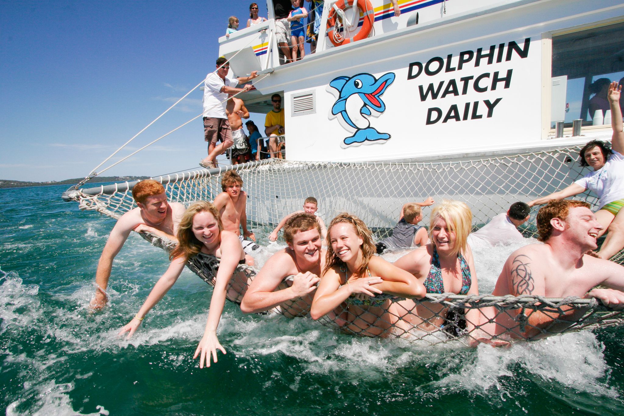 Get suspended over the sea on a super fun boom net and watch the dolphins swim up close.